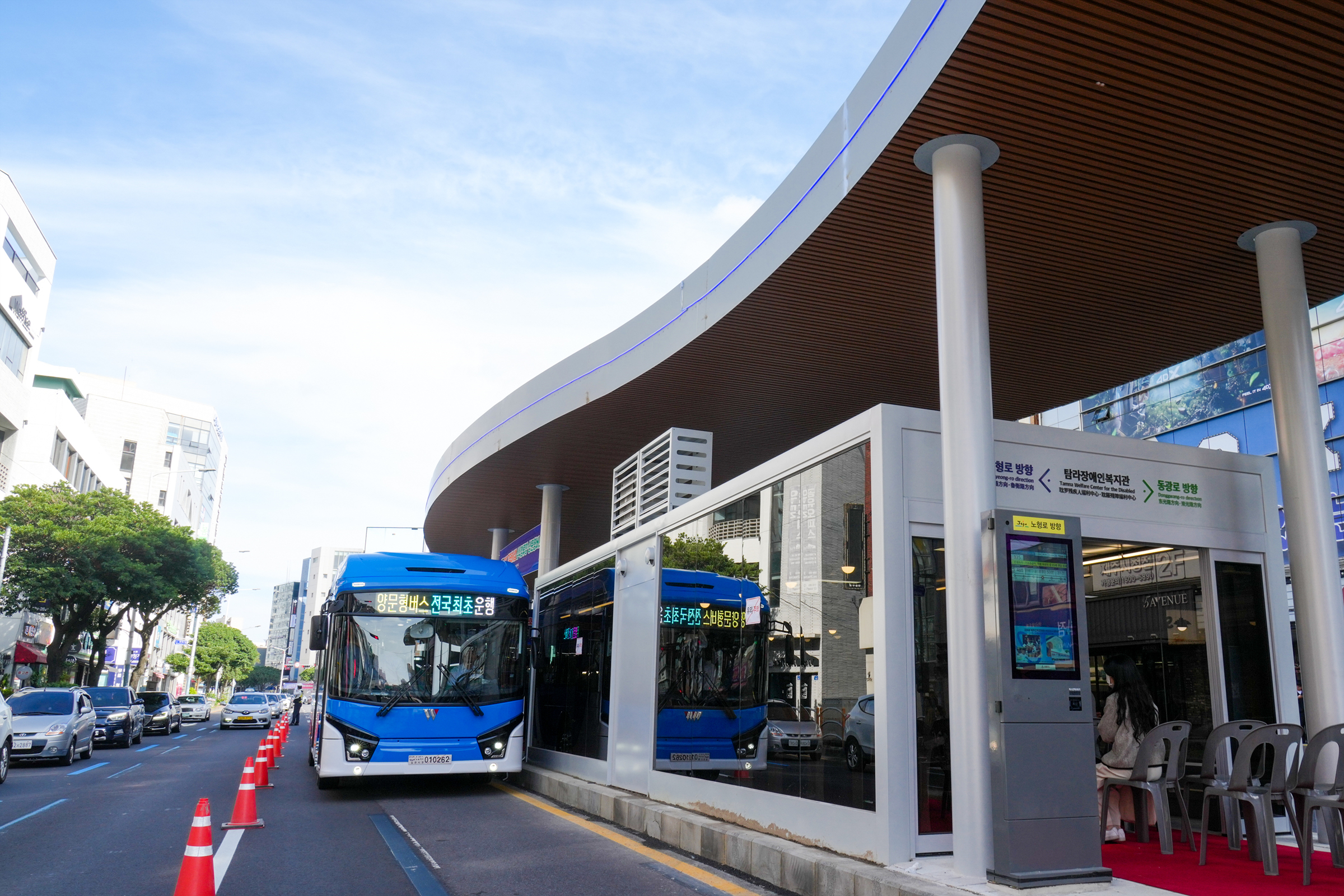 Jeju City bus at an island bus stop