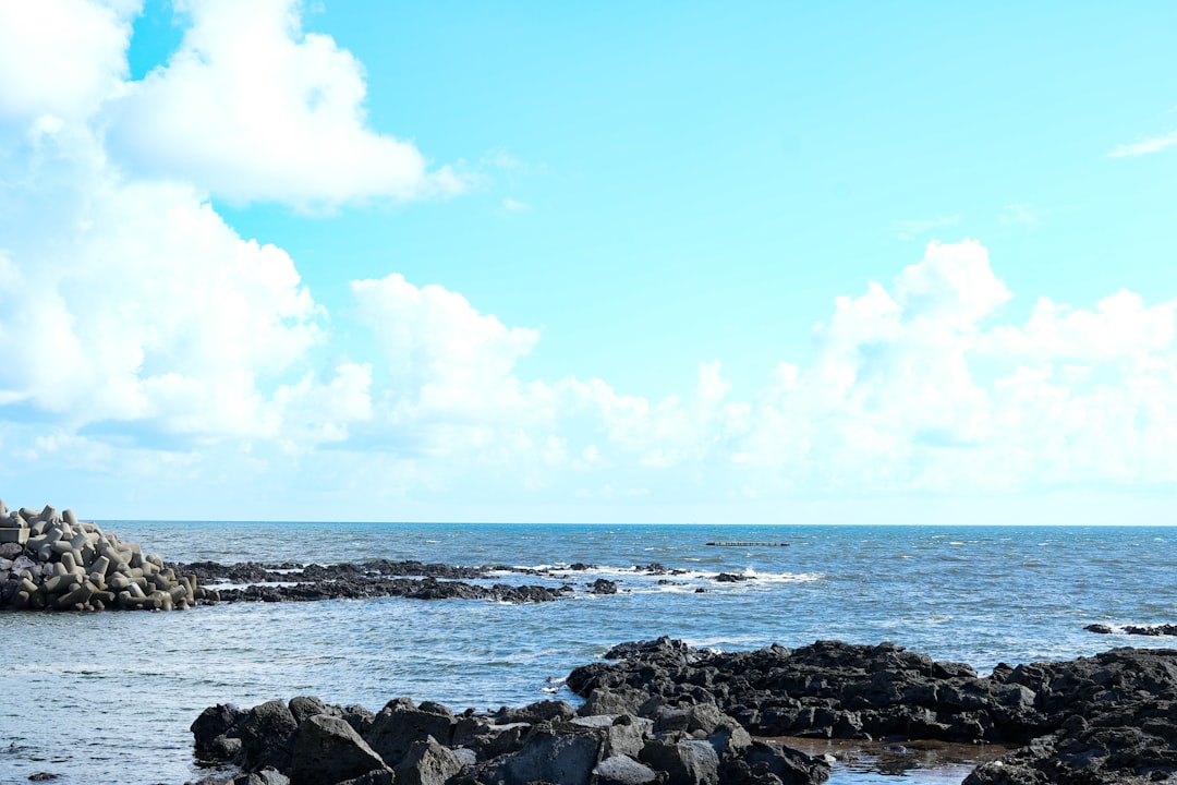 Rocky coastline and blue ocean on Jeju Island, South Korea