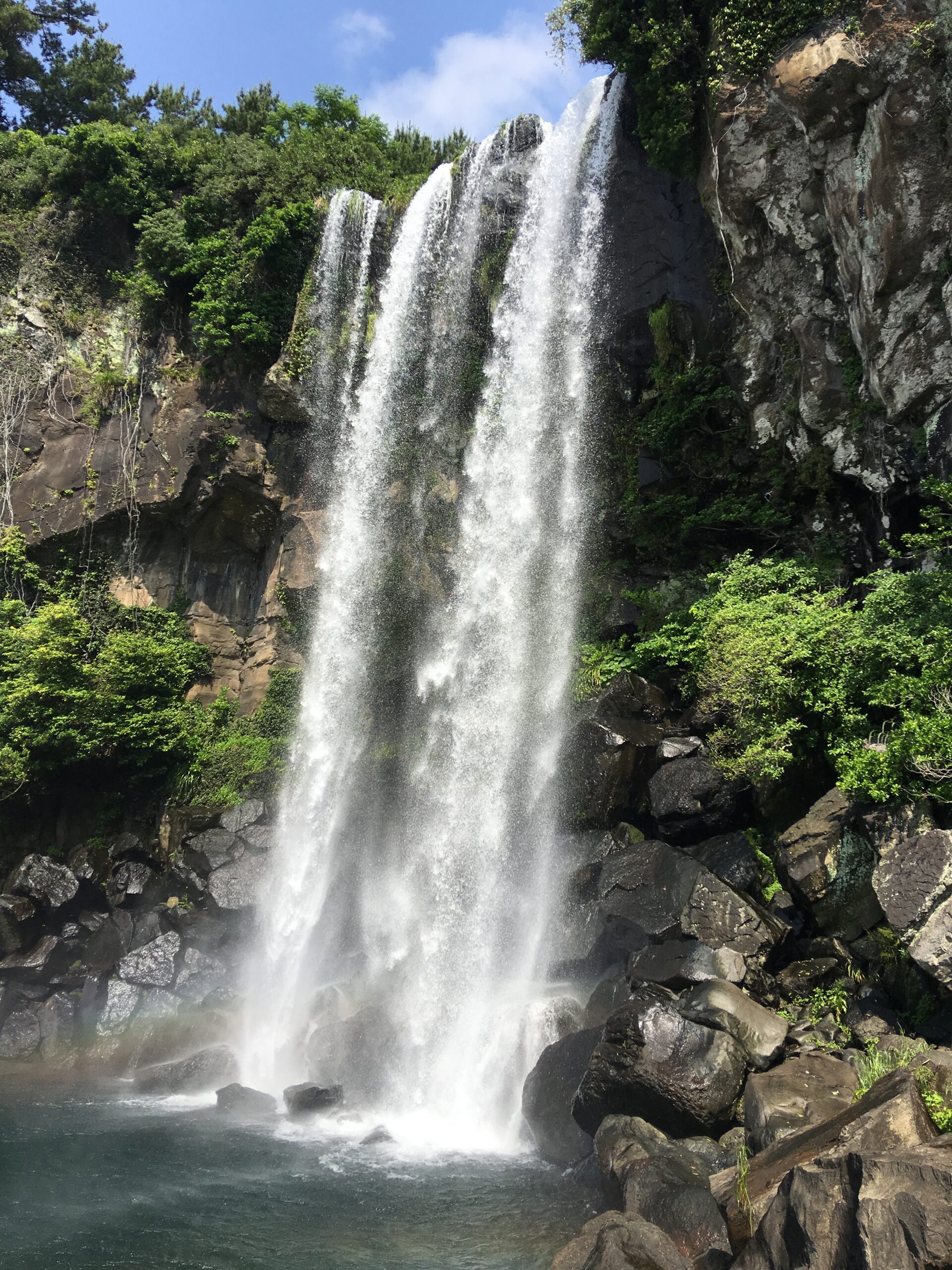 Jeongbang Falls dropping toward the sea in Seogwipo, Jeju