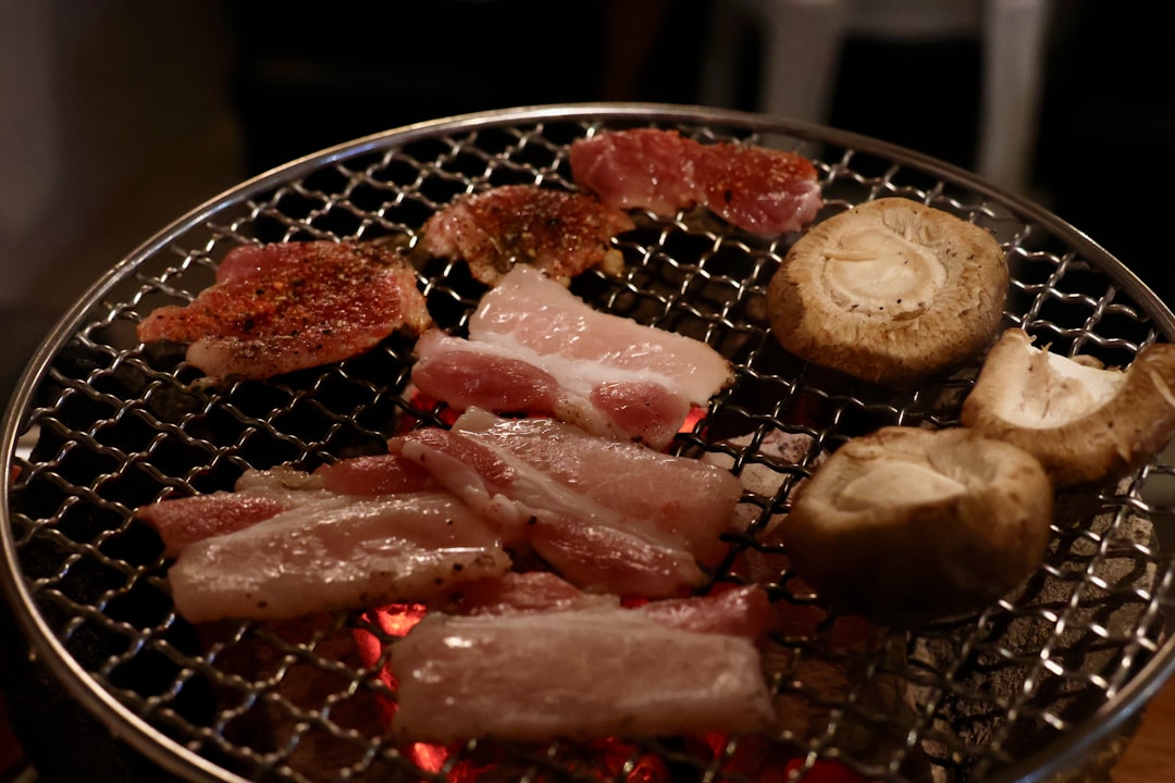 Korean barbecue pork grilling with mushrooms