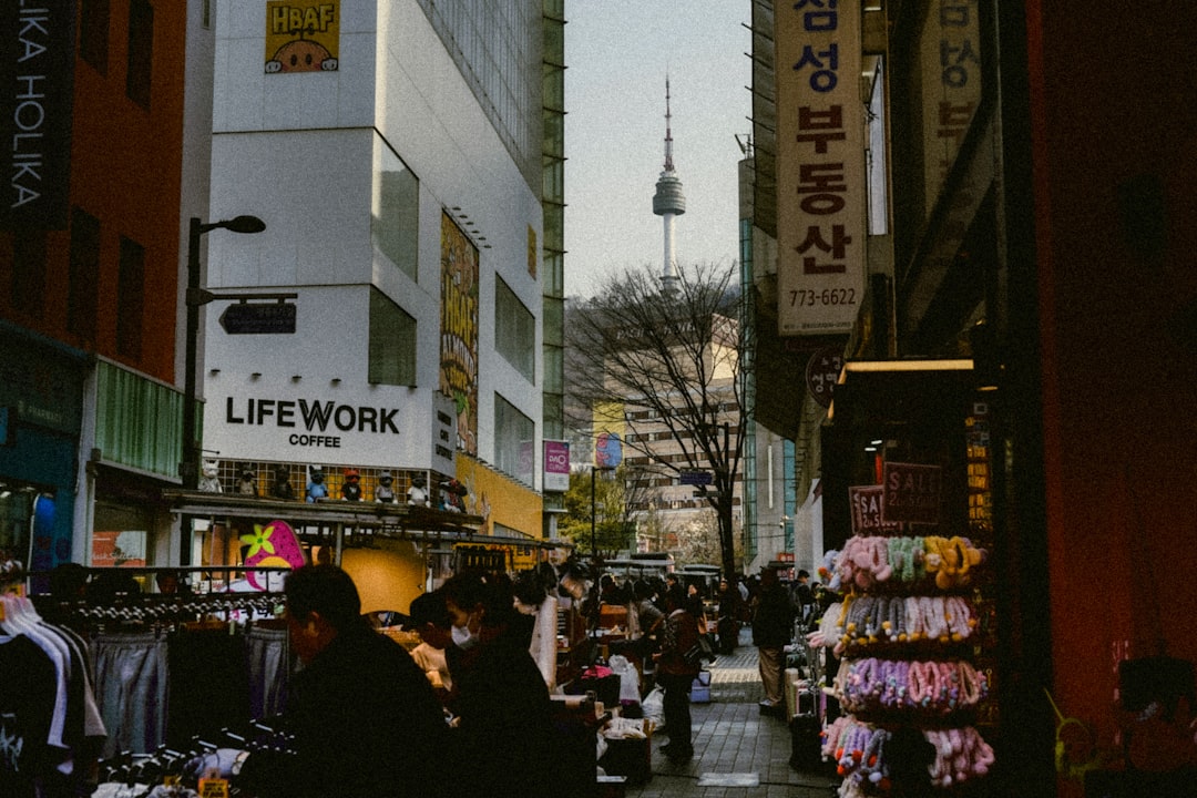 Street market in Seoul with Namsan Tower in the distance