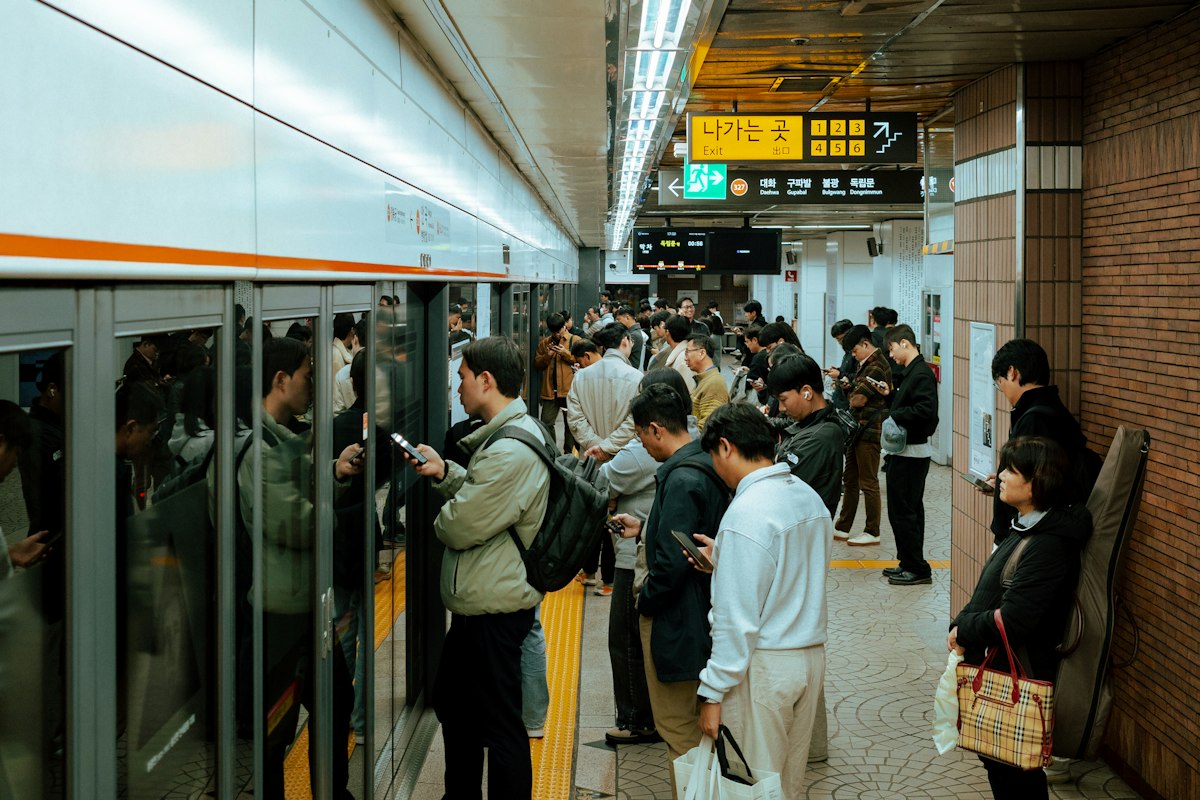 Passengers waiting on a Seoul subway platform